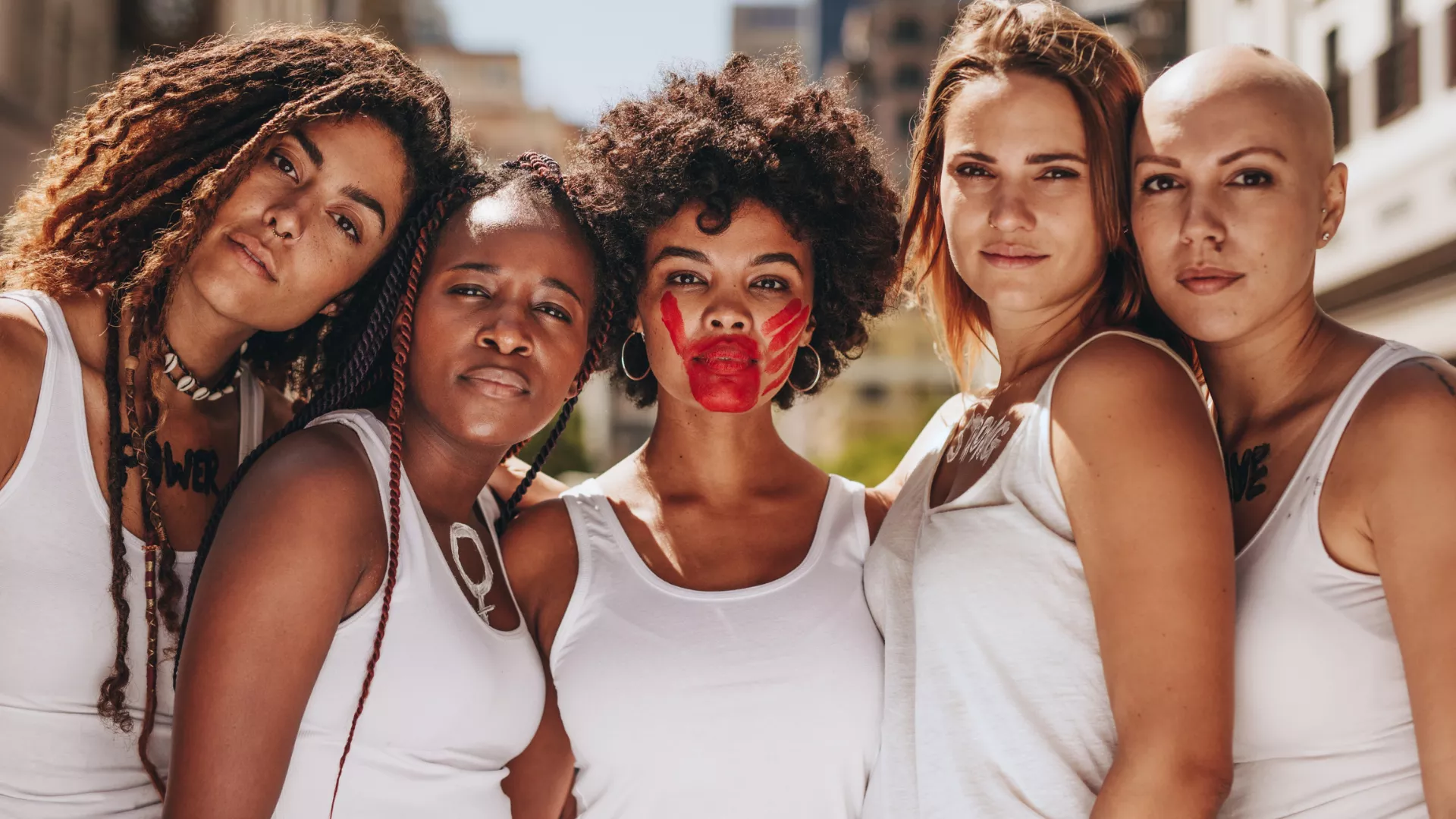 Five women of Multi Racial posing together.
