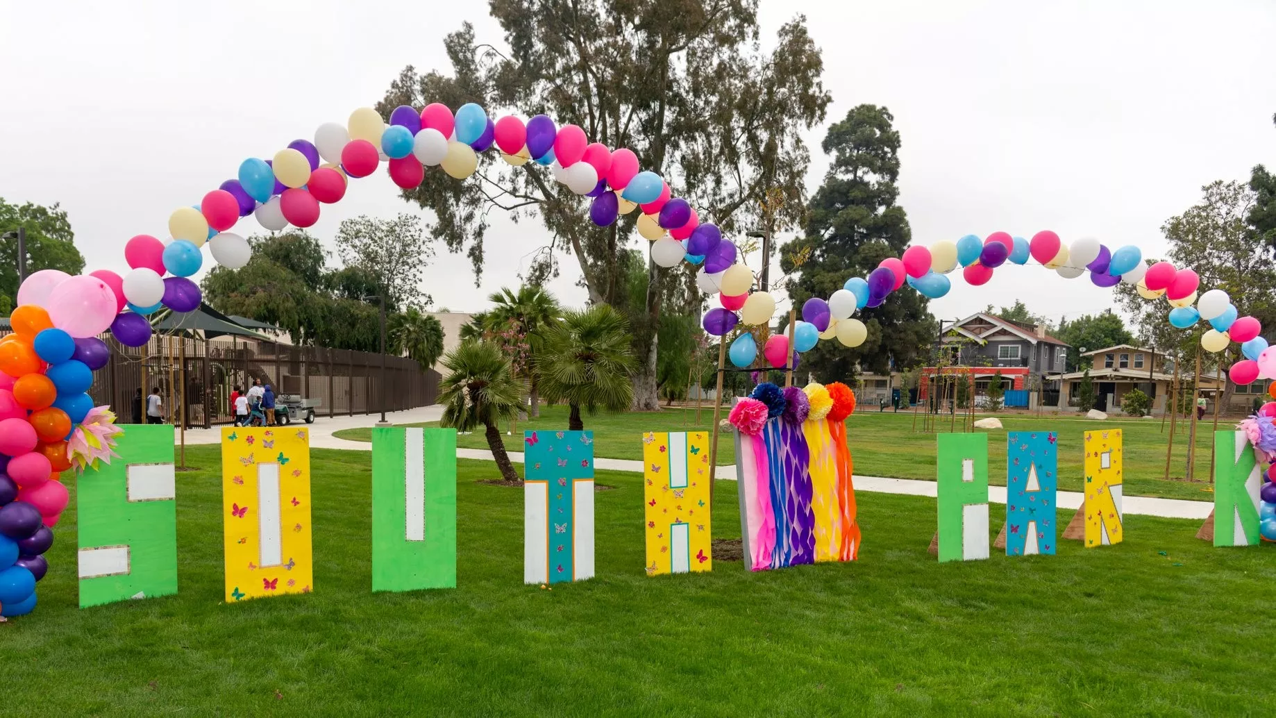 Field picture of a South Park sign and balloon arches